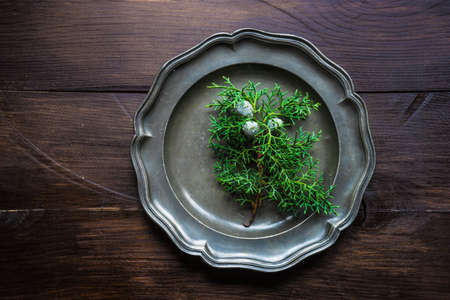 Festive table setting for Christmas dinner on old wooden table with copyspaceの写真素材