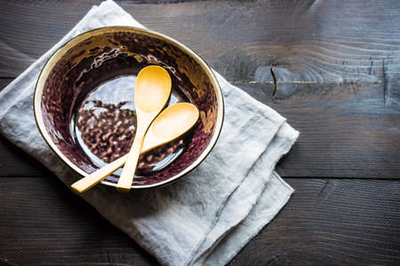 Rustic table setting on vintage wooden table with copyspaceの写真素材