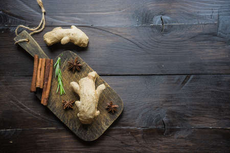 Organic food concept for preparing ginger tea on rustic wooden table with copy spaceの写真素材