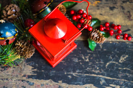 Christmas concept with fir tree leaf, candle and cones on rustic concrete background with copyspaceの写真素材