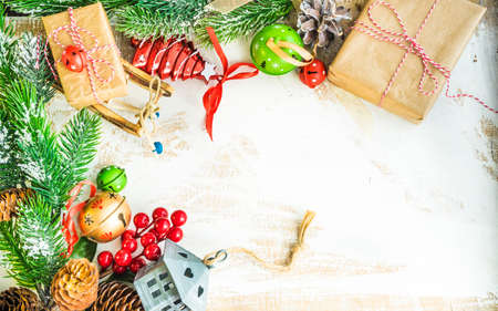 Christmas frame with fir tree and decoration on wooden background with copy space