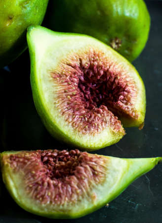 Ripe fig fruits on the stone rustic tableの写真素材