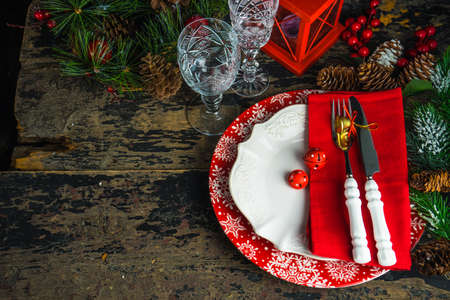 Festive table setting for holiday Christmas dinner on rustic background with copy spaceの写真素材