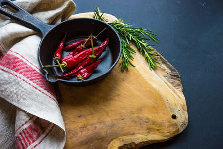 Cooking concept with vintage tableware and spices on old wooden table with copyspace