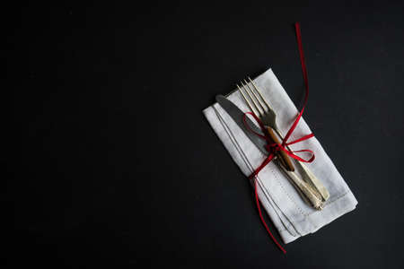 Rustic table setting for festive Christmas dinner with vintage decor on concrete grey backgroundの写真素材
