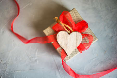 Gifts with heart shaped decor on grey concrete background with copyspaceの写真素材