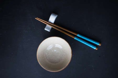 Rustic table set with chopsticks for festive dinner in asian styleの写真素材