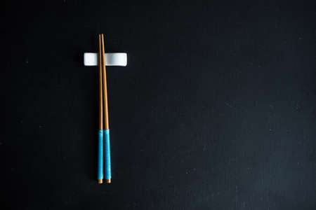 Rustic table set with chopsticks for festive dinner in asian styleの写真素材