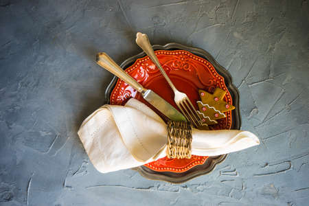 Festive table setting for Christmas dinner on grey concrete tableの写真素材