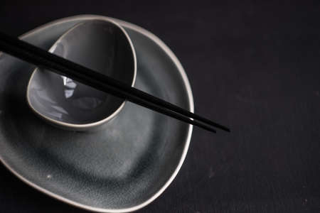 Rustic table set with chopsticks for festive dinner in asian styleの写真素材