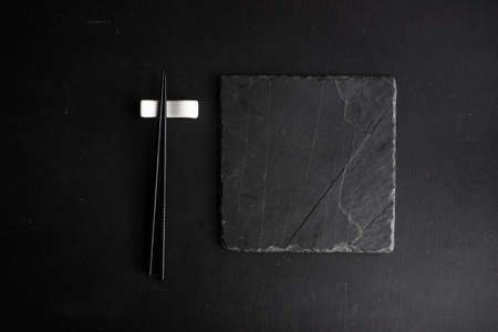 Rustic table set with chopsticks for festive dinner in asian styleの写真素材