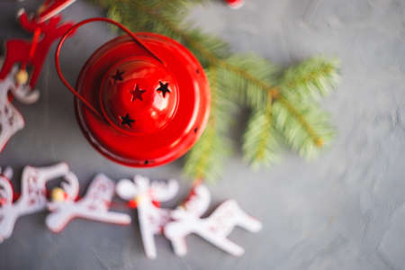 Christmas holiday concept with fir tree, decoration and red vintage lamp on rustic background with copyspaceの写真素材