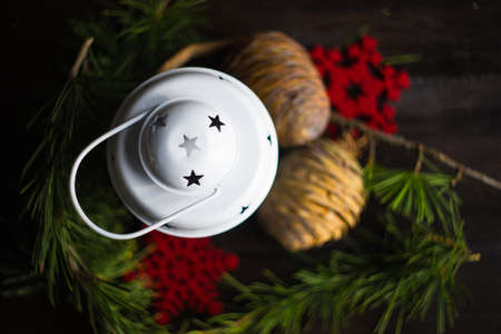 Christmas holiday concept with fir tree, cones, nuts and decoration on rustic background with copyspaceの写真素材
