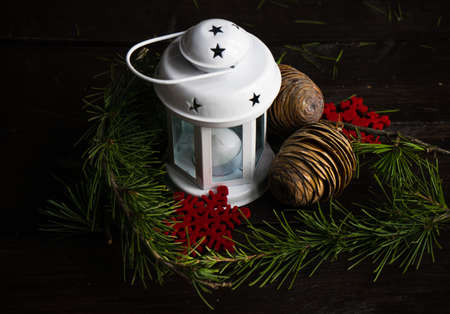 Christmas holiday concept with fir tree, cones, nuts and decoration on rustic background with copyspaceの写真素材