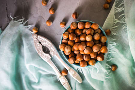 Organic nuts in a bowls on rustic wooden background as a healthy food conceptの写真素材