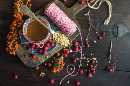 Organic nut butter with berries and nuts on white vintage table with copyspaceの写真素材