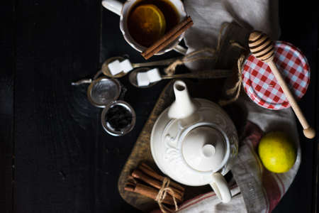Cup of tea with ginger, lemon and honey on rustic wooden table with copyspaceの写真素材