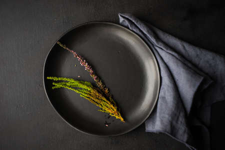 Table setting with heather flowers on dark woodenn table with copyspaceの写真素材