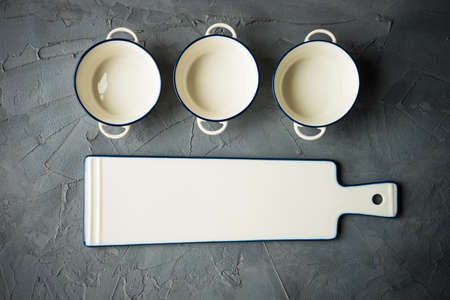 Empty ceramic tableware on dark wooden tableの写真素材