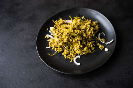 Traditional georgian dish - jonjoli, on rustic table with copyspace