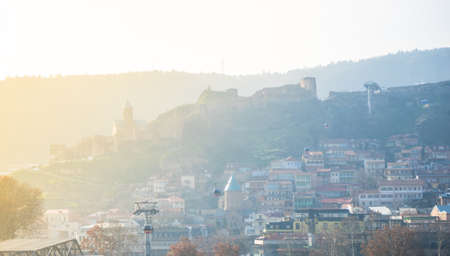 Georgia - Tbilisi. View to the most famous park and Peace bridge in Tbilisi, downtown in wintertime in sunny day. Mix of ancient and modern architecture of Old Tbilisi, capital city of Republic of Georgia in Caucasus region. 21.01.2018のeditorial素材