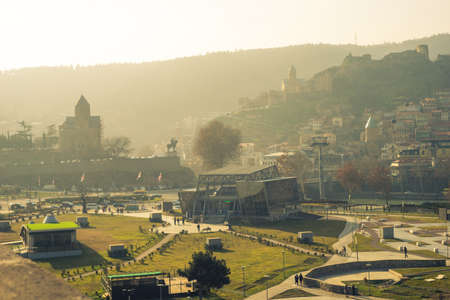Georgia - Tbilisi. View to the most famous park and Peace bridge in Tbilisi, downtown in wintertime...