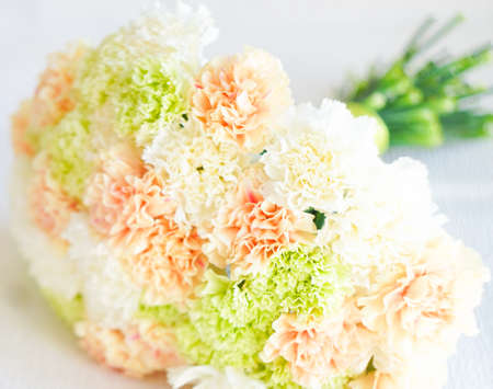 Beautiful bridal bouquet with fresh pastel colored carnation flowersの写真素材