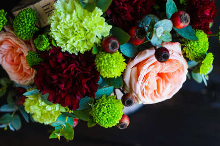Summer flowers in gift box on dark wooden backgroundの写真素材
