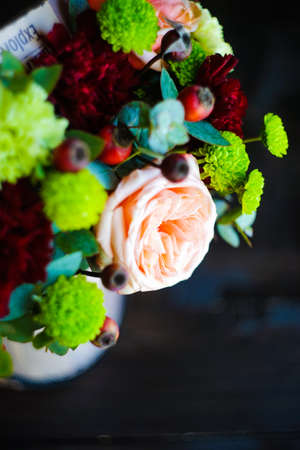 Summer flowers in gift box on dark wooden backgroundの写真素材