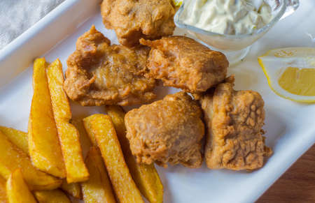 Traditional dinner with fried potato and meat on plate