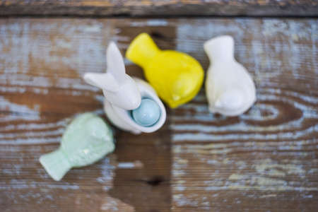 Easter holiday card with easter eggs and birds on rustic wooden background with copy spaceの写真素材