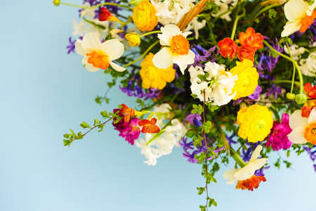 Summer bouquet with bright yellow and white flowers on rustic background with copyspaceの写真素材