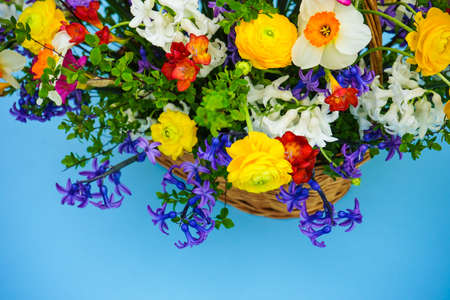 Summer bouquet with bright yellow and white flowers on rustic background with copyspaceの写真素材