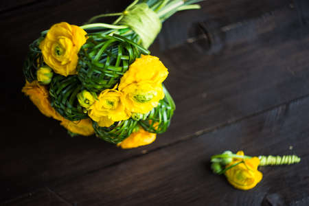 Beautiful yellow ranunculus flowers in bridal bouquetの写真素材