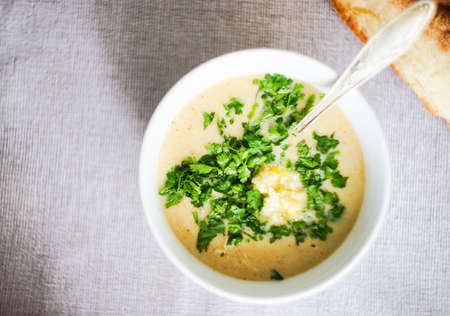 Traditional georgian chicken soup - Chikhirtma with tonis puri and lemon on dark wooden tableの写真素材