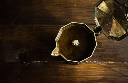 Traditional italian coffee maker on wooden backgroundの写真素材