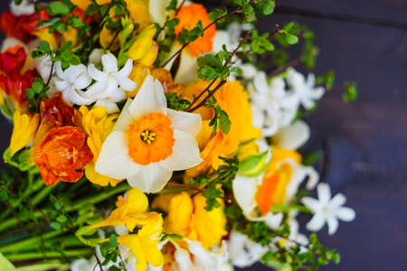 Summer bouquet with bright yellow and white flowers on rustic background with copyspaceの写真素材