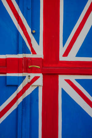 British flag concept - old door colored in the colors of the flag of UKの写真素材
