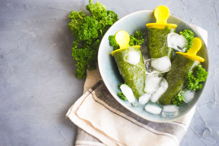 Vegan herb and vegetable ice cream on dark wooden table with copy spaceの写真素材