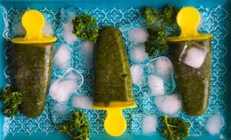 Vegan herb and vegetable ice cream on dark wooden table with copy spaceの写真素材