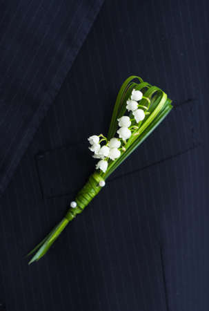 Beautiful may lilies in bride bunch on rustic background with copy space