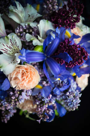 Beautiful Alstroemeria, lilac and iris flowers in bride bunch on rustic background with copy spaceの写真素材
