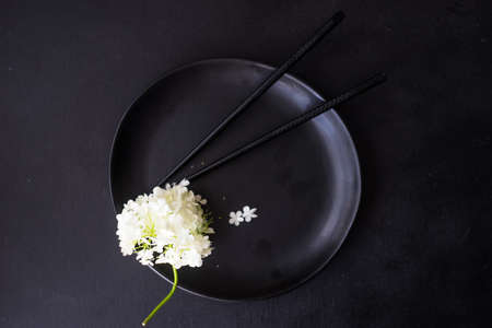 Summer table setting with white  Viburnum opulus 'Roseum' flowers on rustic backgroundの写真素材