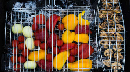 Fresh vegetables and mushrooms on a grill as a healthy food concept