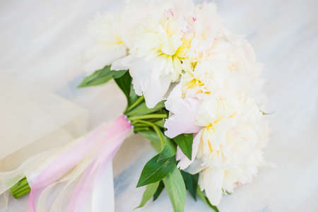 Beautiful bridal bouquet with white peony flowersの写真素材