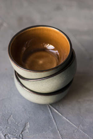 Empty ceramic bowls on rustic background with copy spaceの写真素材