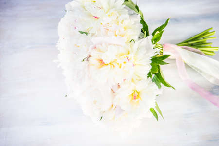 Beautiful bridal bouquet with white peony flowersの写真素材