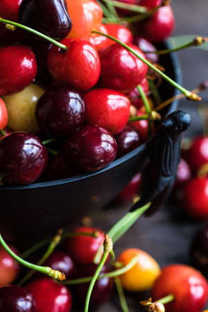 Fresh organic sweet cherries in vintage styled busket with copy spaceの写真素材