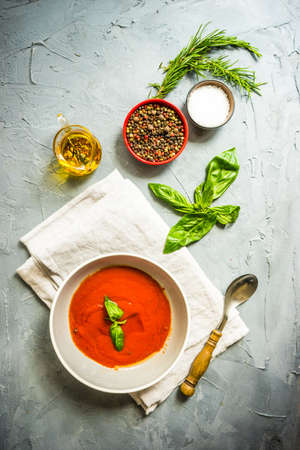 Traditional spanish tomato cream soup Gazpacho in ceramic bowl on concrete background with copy spaceの写真素材