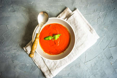 Traditional spanish tomato cream soup Gazpacho in ceramic bowl on concrete background with copy spaceの写真素材
